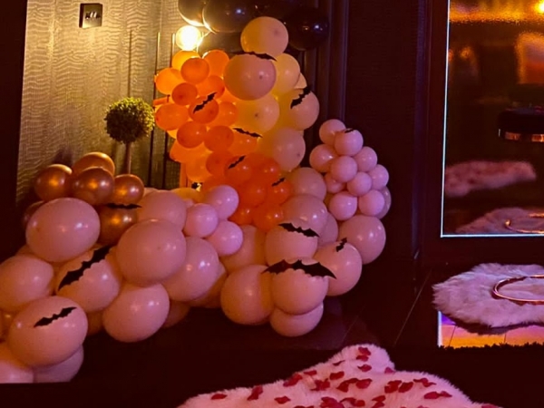 Cascading Crib Balloons with Rose Petals