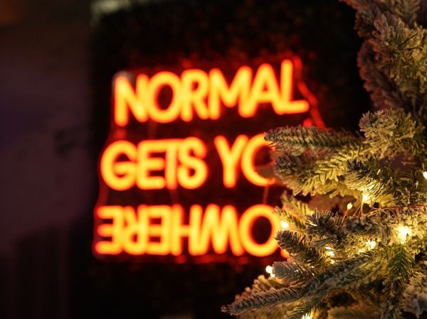 The Cave neon sign with festive trimmings