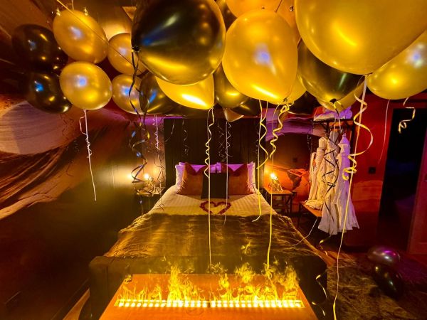 The Cave bedroom with fire wall and 20 ceiling balloons