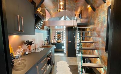 Looking into the Chalet - mezzanine bed, kitchen and bathroom